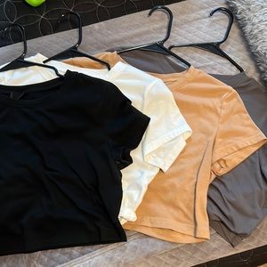 Four SHEIN crew neck crop tops